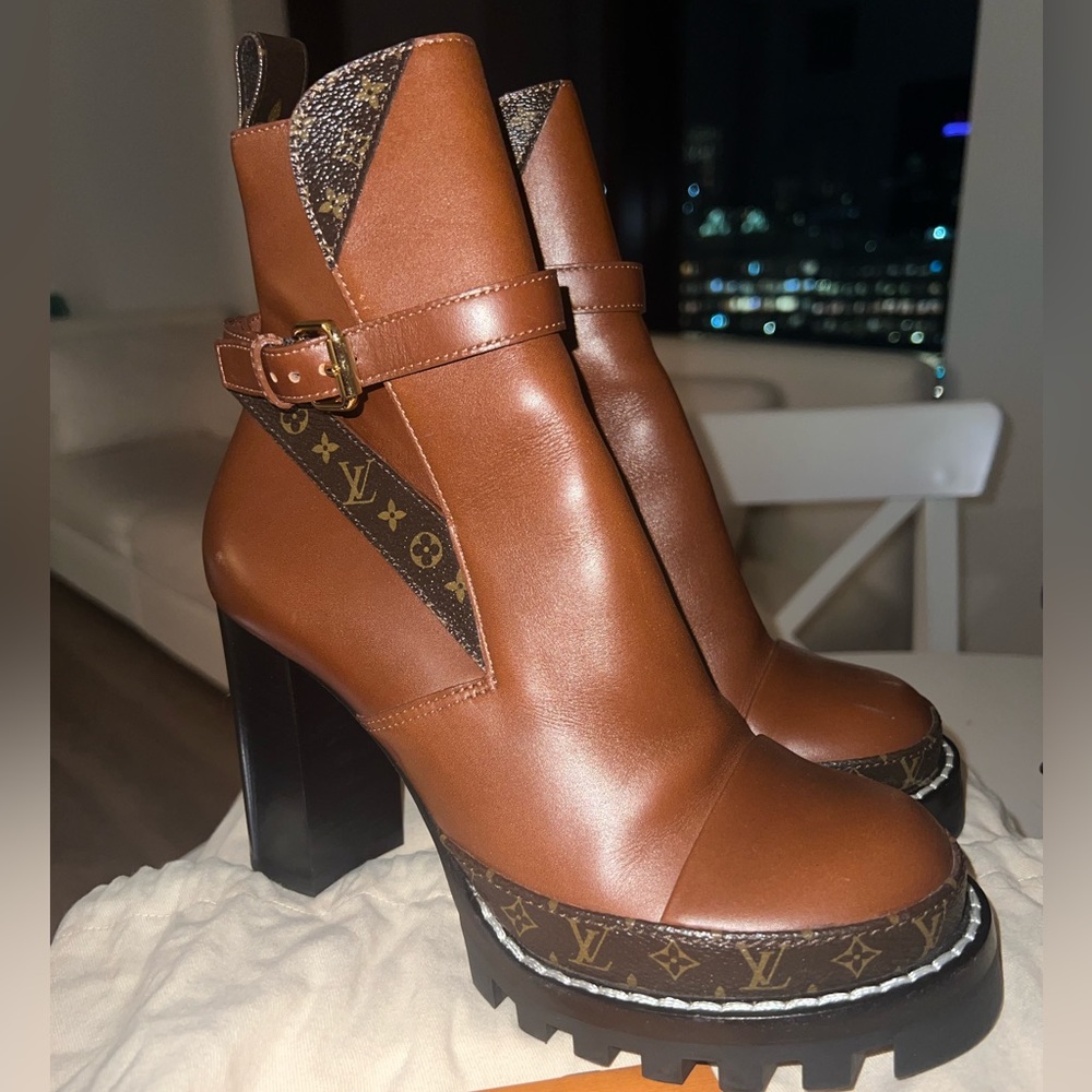 LOUIS VUITTON Star Trail Buckle Ankle Monogram Leather Boots.